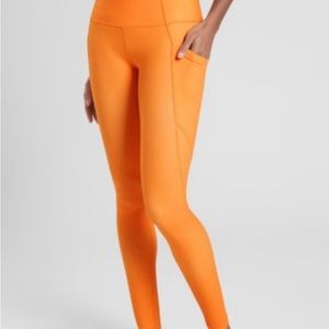 Athleta Salutation Stash Pocket Leggings Orange Small EUC!